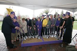 University administrators, donors and friends assembled under a tent on the Quad as the rain fell around them during the official ceremonial groundbreaking for the Forbes Center for the Performing Arts.